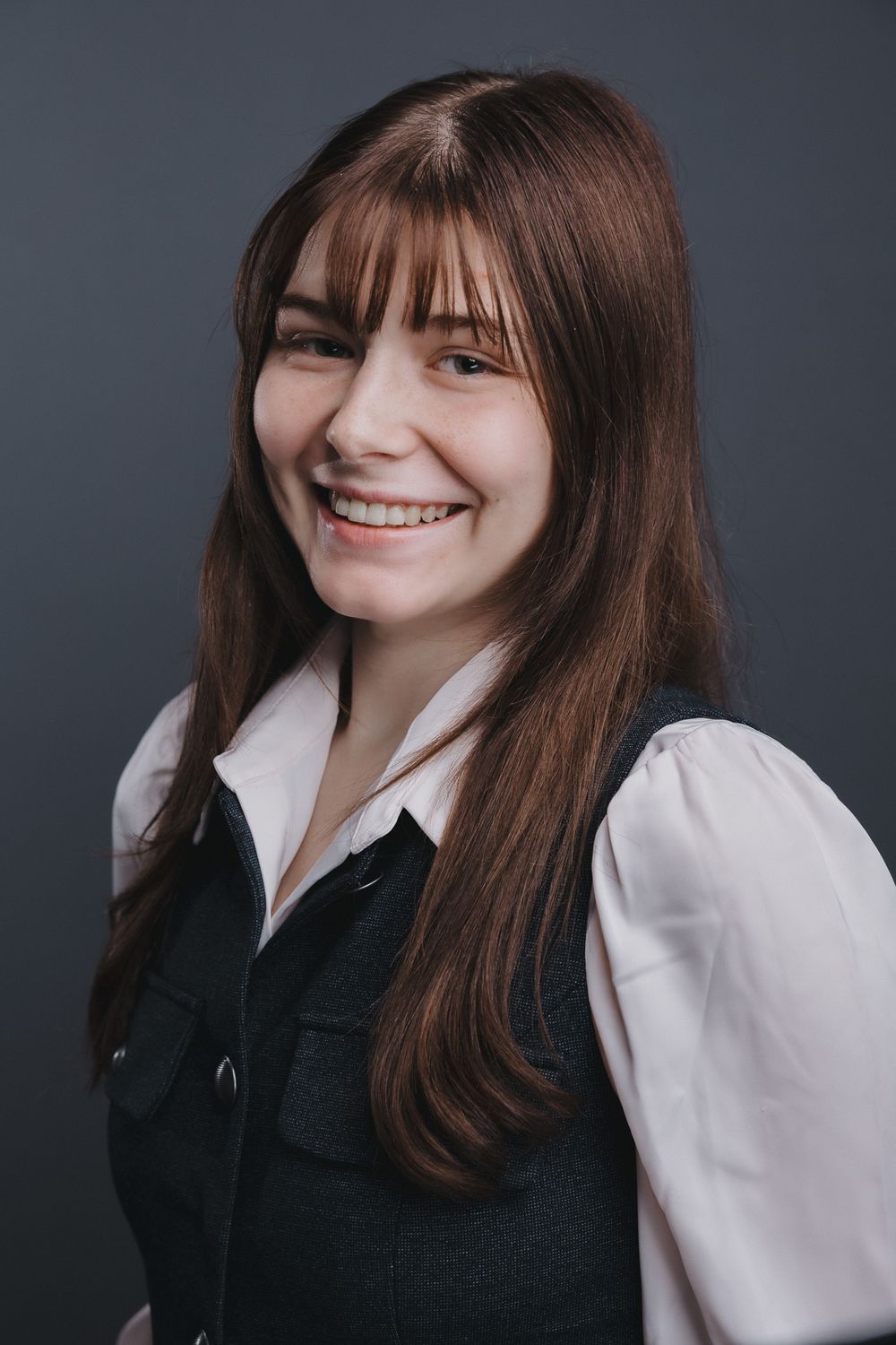 Candid portrait sequence featuring warm smiles and natural poses in contrasting white and dark clothing.
