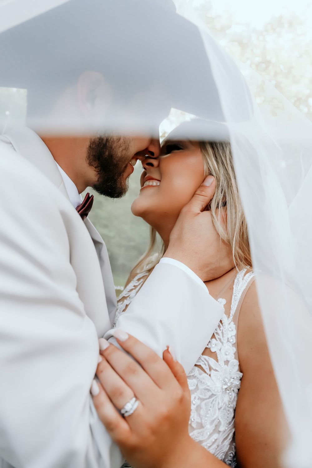 Romantic wedding photography sequence showing tender moments under a white veil.