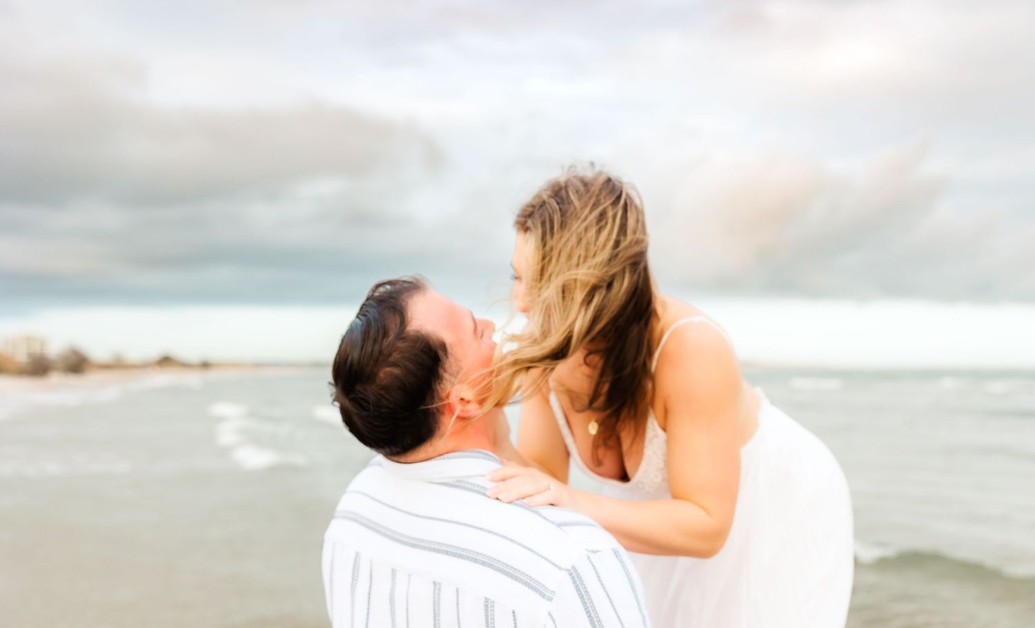 Romantic couple shares intimate moment on beach at sunset. PRESLEY ROSE PHOTOGRAPHY OCEAN ISLE BEACH SUNSET BEACH BRUNSWICK BEACH