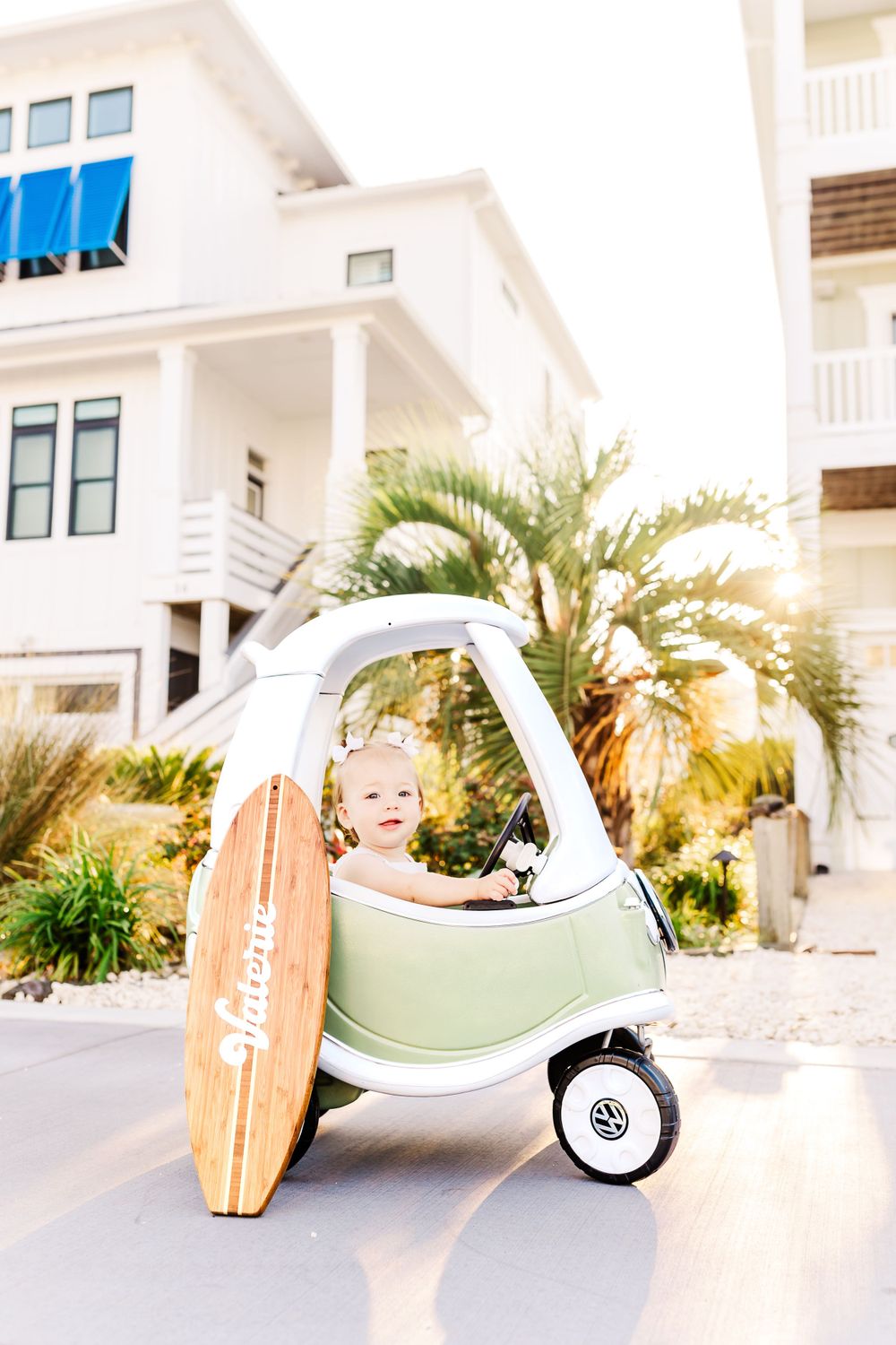 A triptych of beachy images showing a surfboard, golf cart, and palm trees against white coastal architecture.