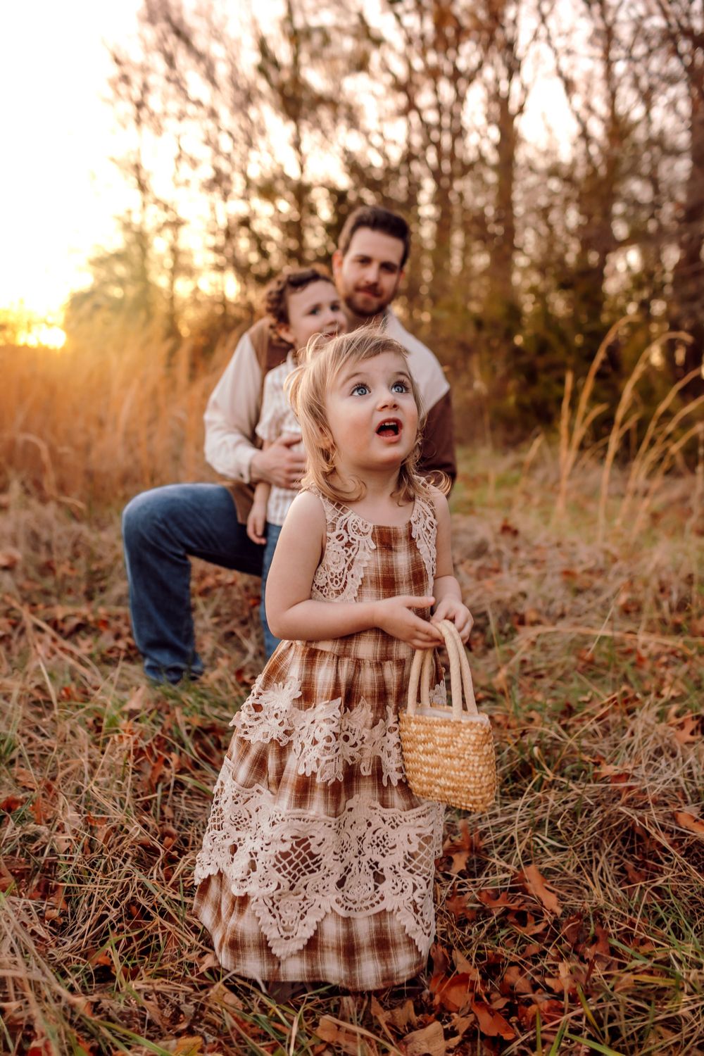 Father and kids together in a candid moment during family photo session in Mooresville NC