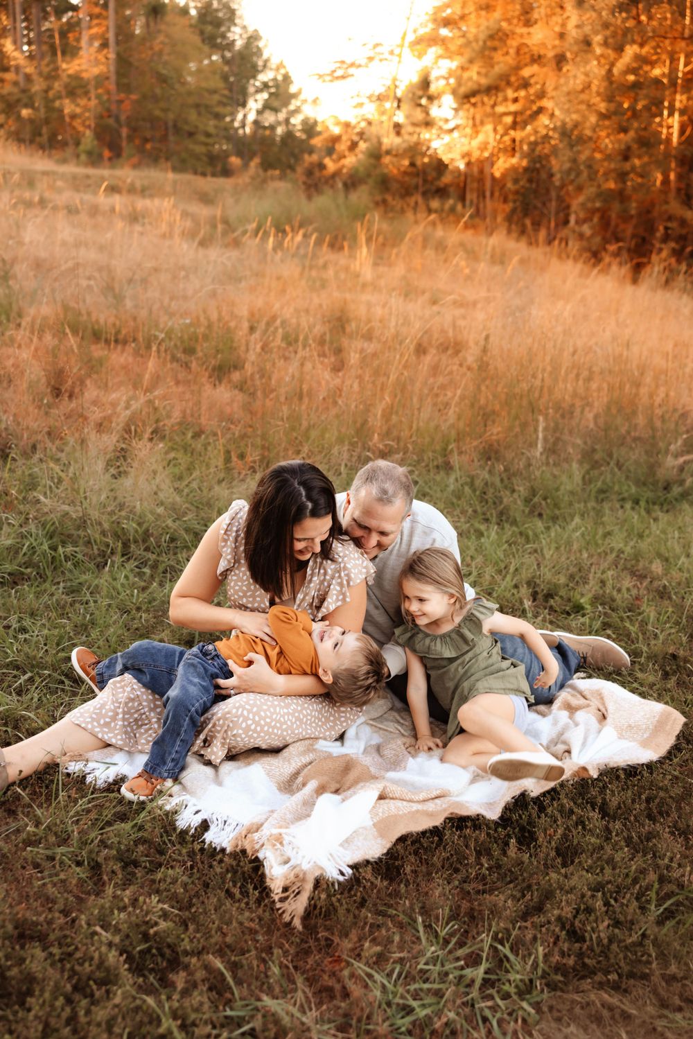 Joyful family photos in Mooresville NC with warm sunlight