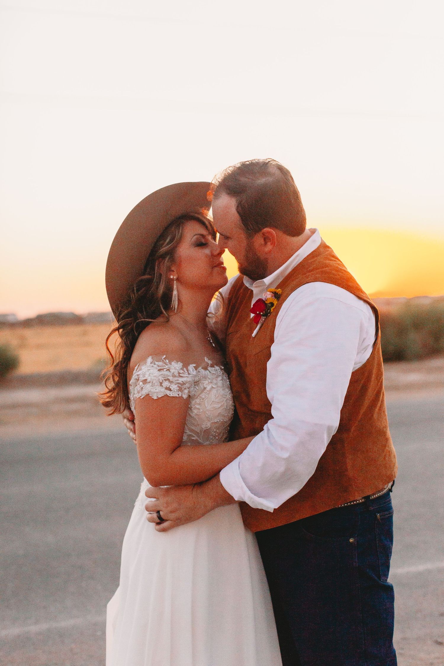Sunset desert wedding photos with beautiful golden hour lighting.