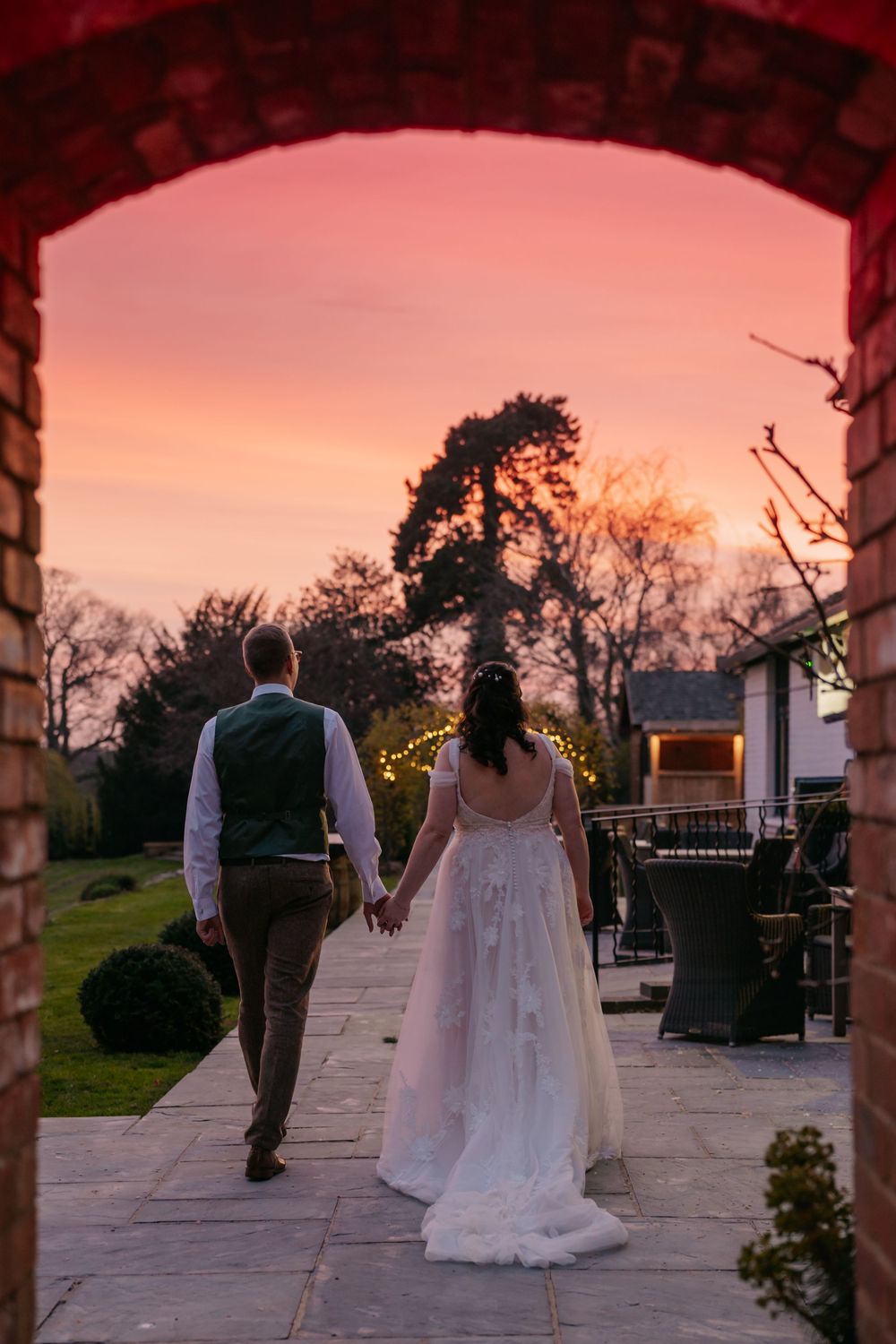 A romantic sunset wedding sequence shows a couple dancing on a stone patio as the sky turns pink and orange.