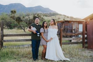 Desert mountain landscape serves as stunning backdrop for family photo session.