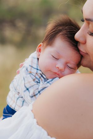 Tender close-up moment captured during outdoor family photoshoot.