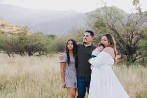 Desert landscape family portrait with mountains and natural scenery.
