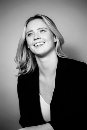 Black and white portrait series showing expressive poses and dramatic lighting effects.