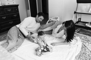A series of black and white photos showing a person sleeping in various positions on a bed.