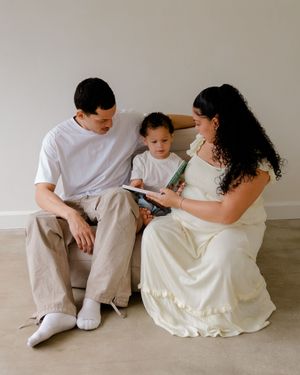 A series of intimate family moments captured in warm tones showing interaction between parent and child on a light floor.