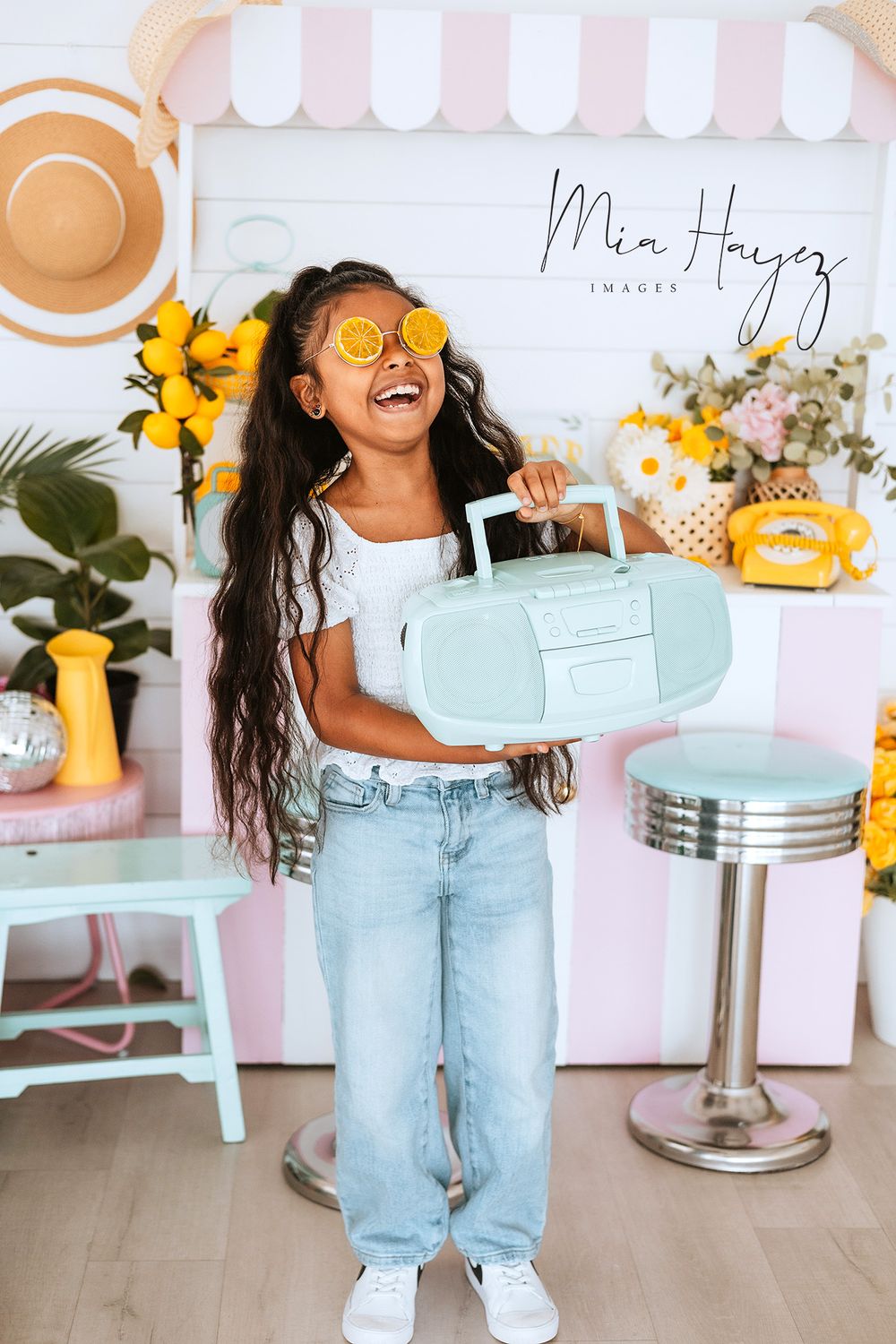 Retro diner themed photoshoot with pastel colors and sunflowers.