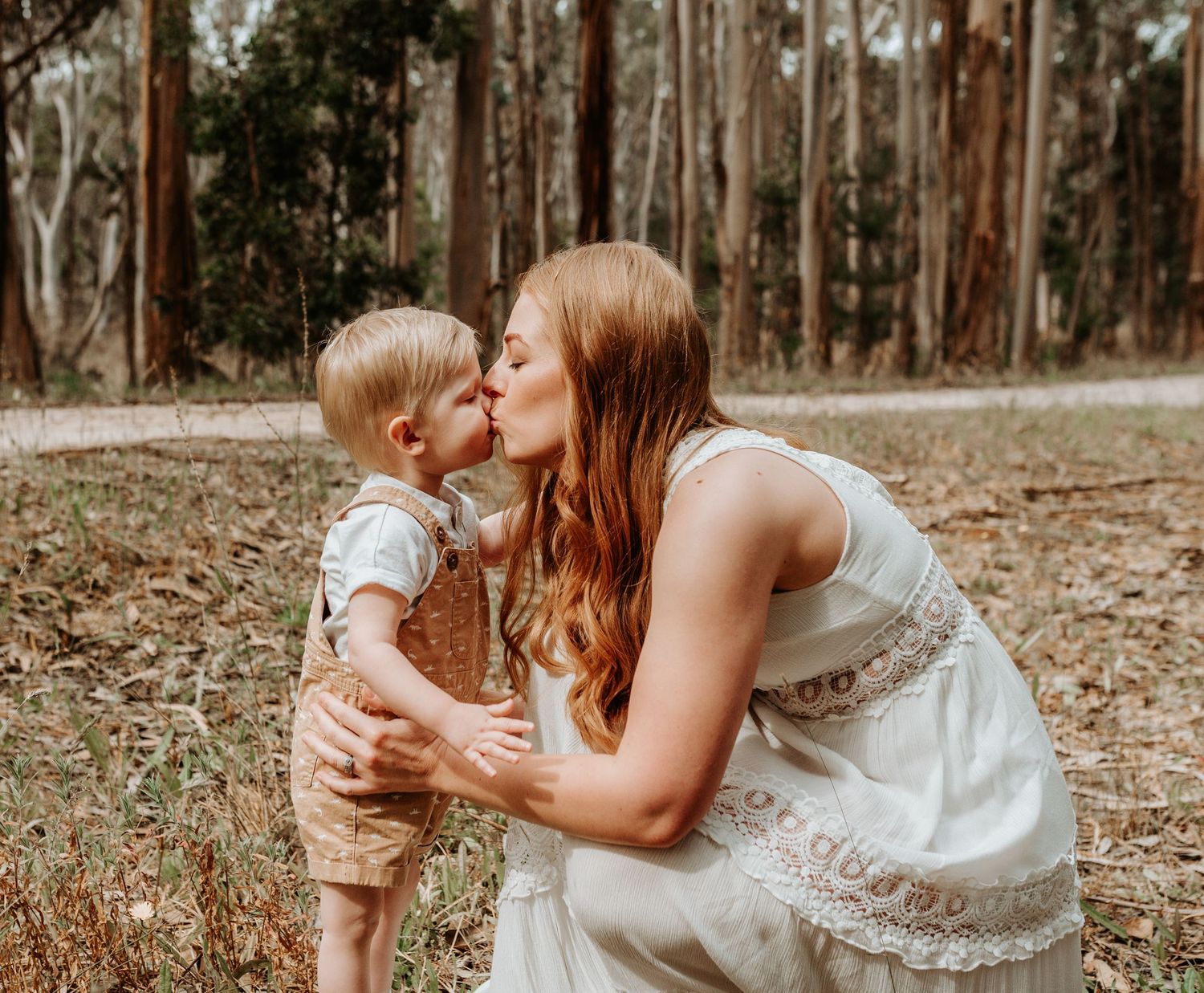 A heartwarming series of outdoor family photos showing tender moments between parent and child in a wooded setting.