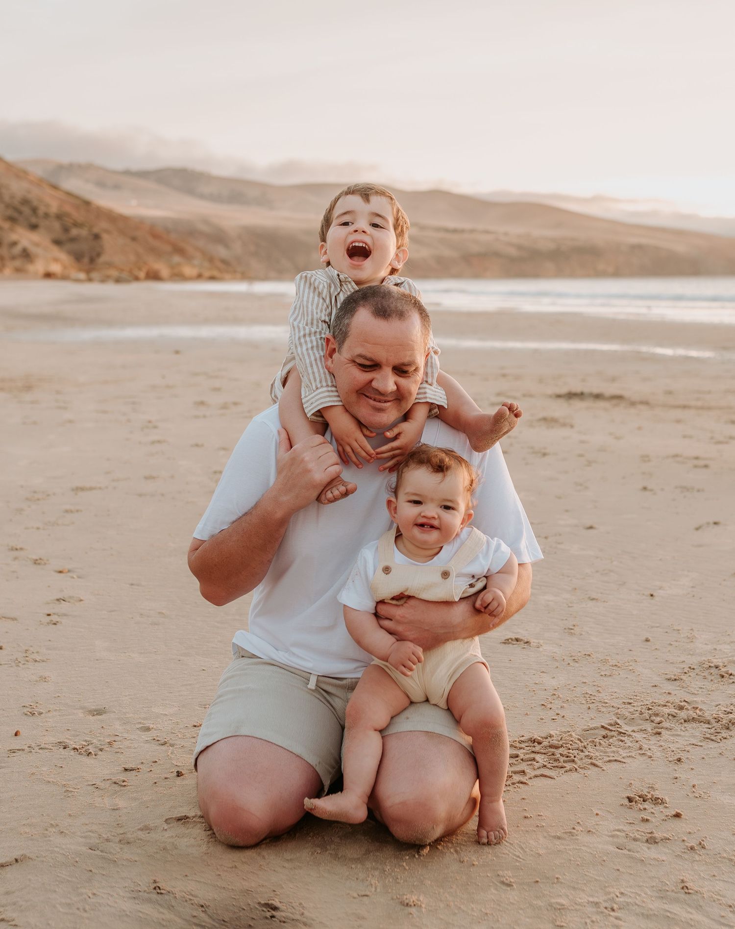 Candid family photos showing joyful interactions on a sandy beach at sunset.
