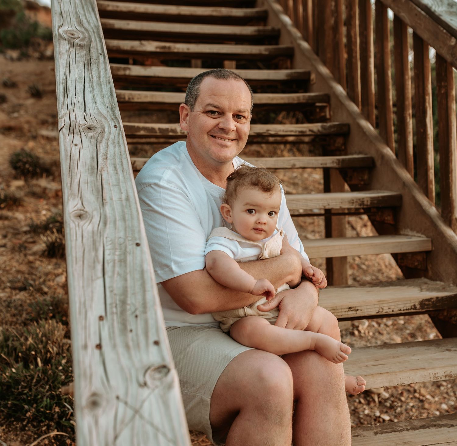 A series of candid moments on wooden stairs in warm lighting.