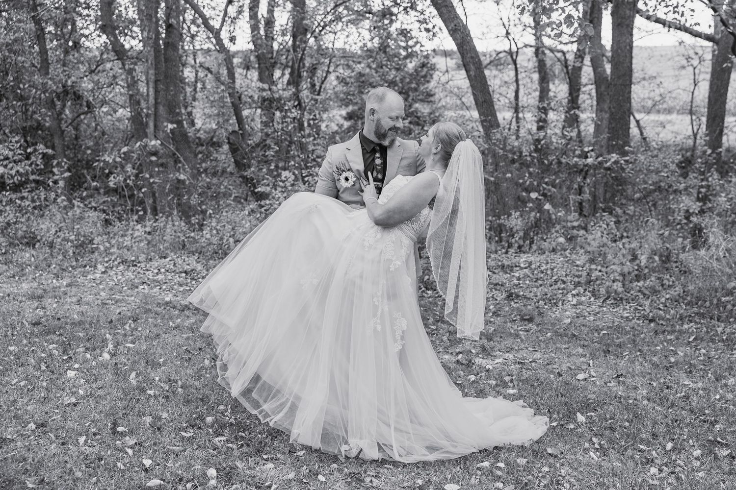 Couple getting married in a field.