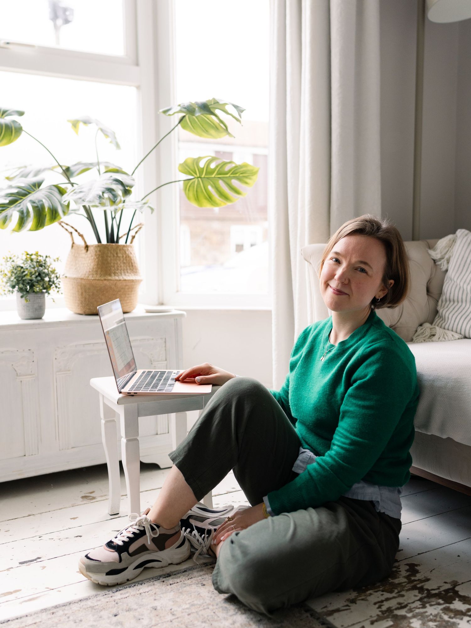 female business owner n relaxed branding photography shoot working at kitchen table