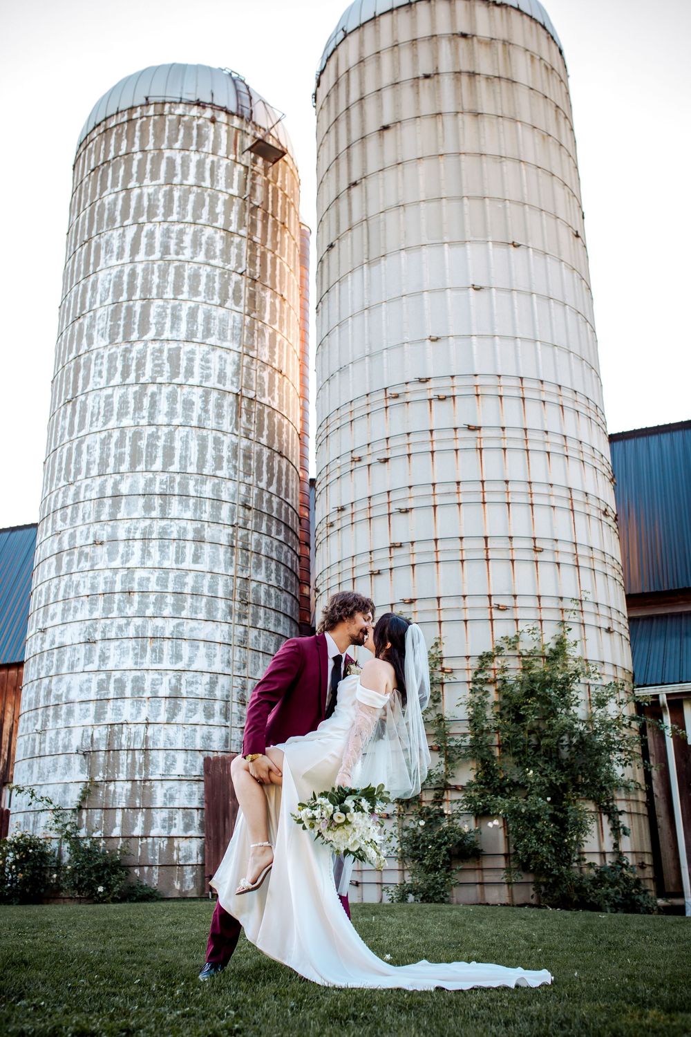 Rochester Wedding Photographer Jess Trankle Images photographs the bride and groom by The Twin Silos in Livonia, N.Y. at Barn Wedding