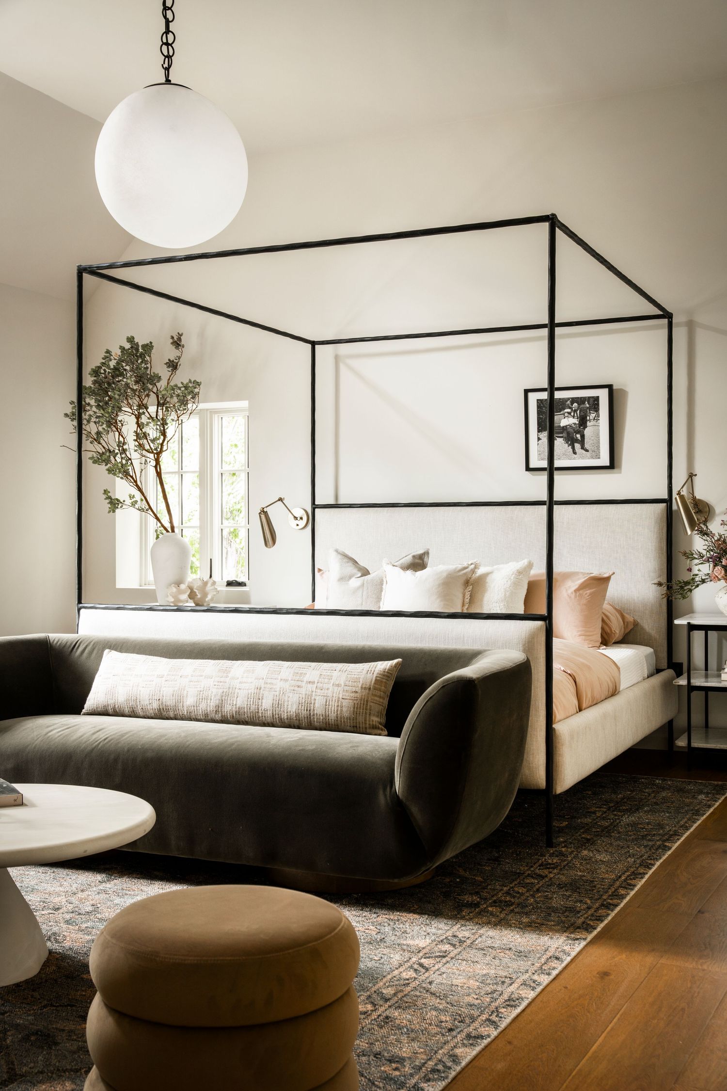 Interior photo series showing modern bedroom with four-poster bed, curved sofa, and minimalist decor in neutral tones.