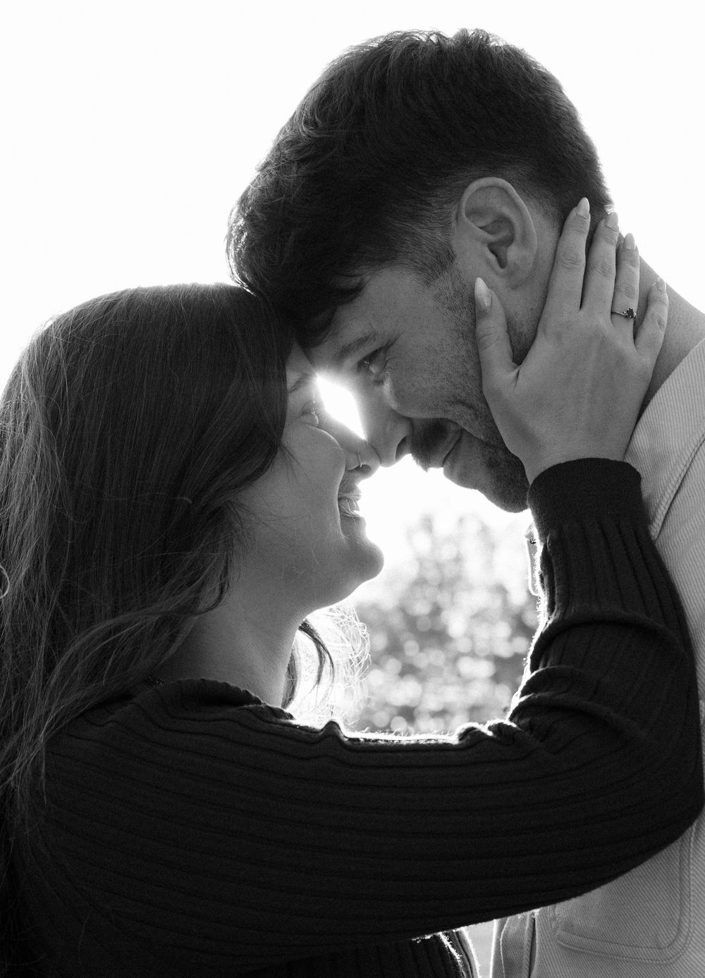 A series of black and white romantic silhouettes showing a couple in intimate poses against a light background.