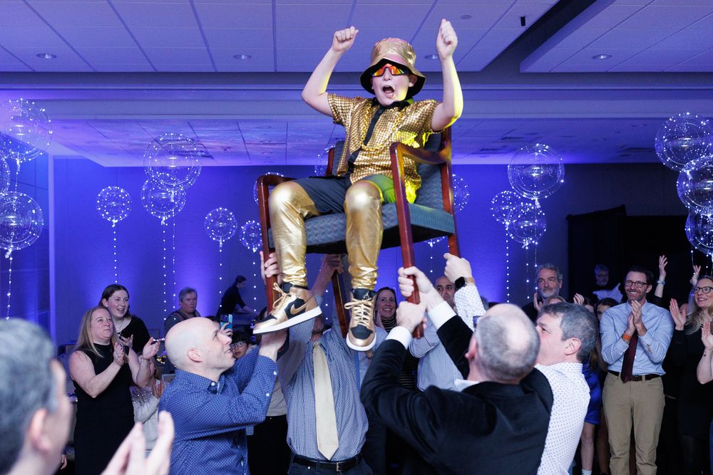 Joyful Bar Mitzvah celebration with lively moments. Serving Providence, Boston, and Newport with expert wedding, Bar Mitzvah