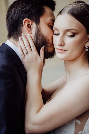 A romantic series of close-up shots showing tender moments between a couple in formal attire.