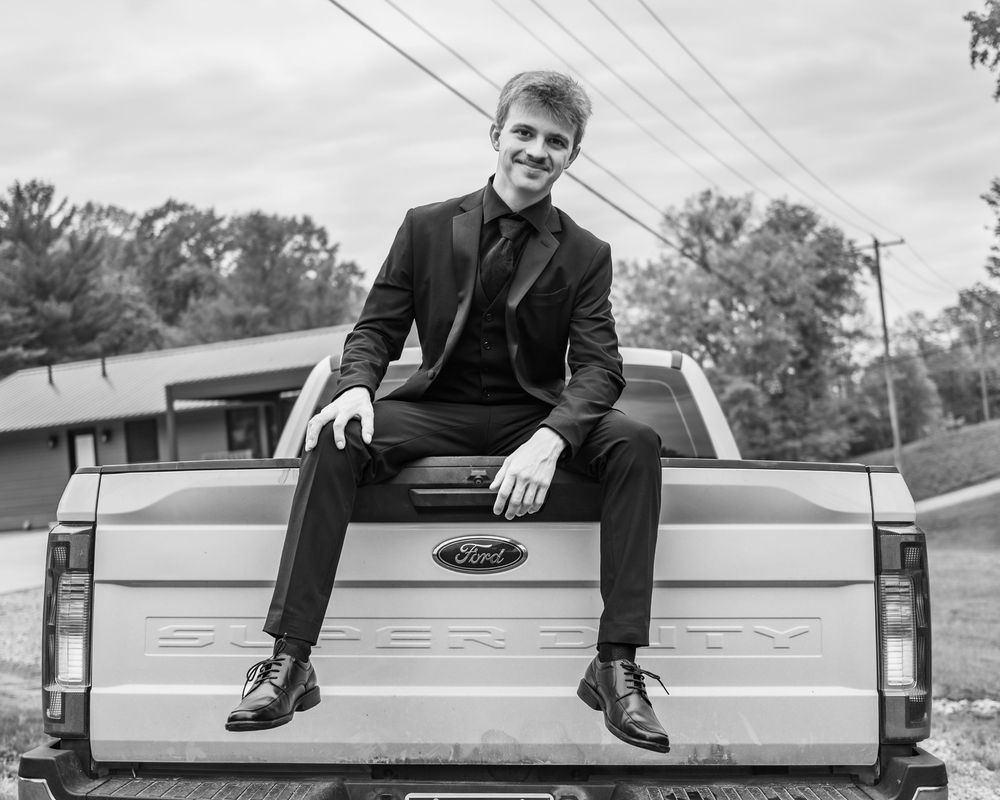 Modern Ford pickup truck tailgate with formal attire photoshoot.