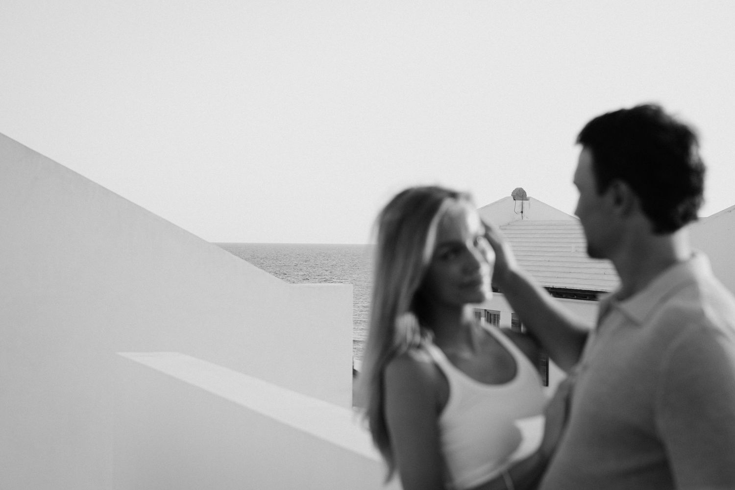 Black and white photo of a romantic beach moment.