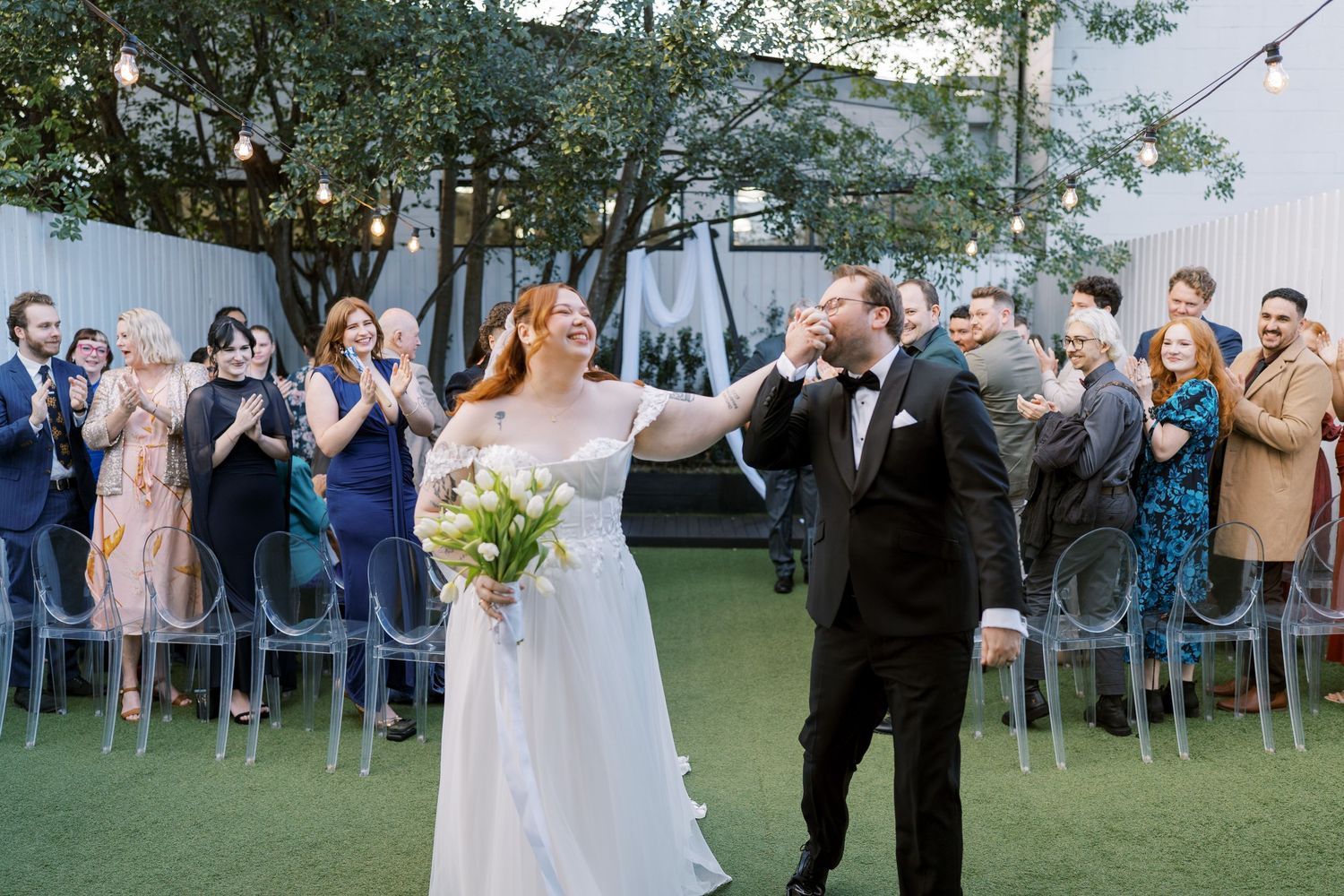Bridal party looking at their flowers during bridal portraits