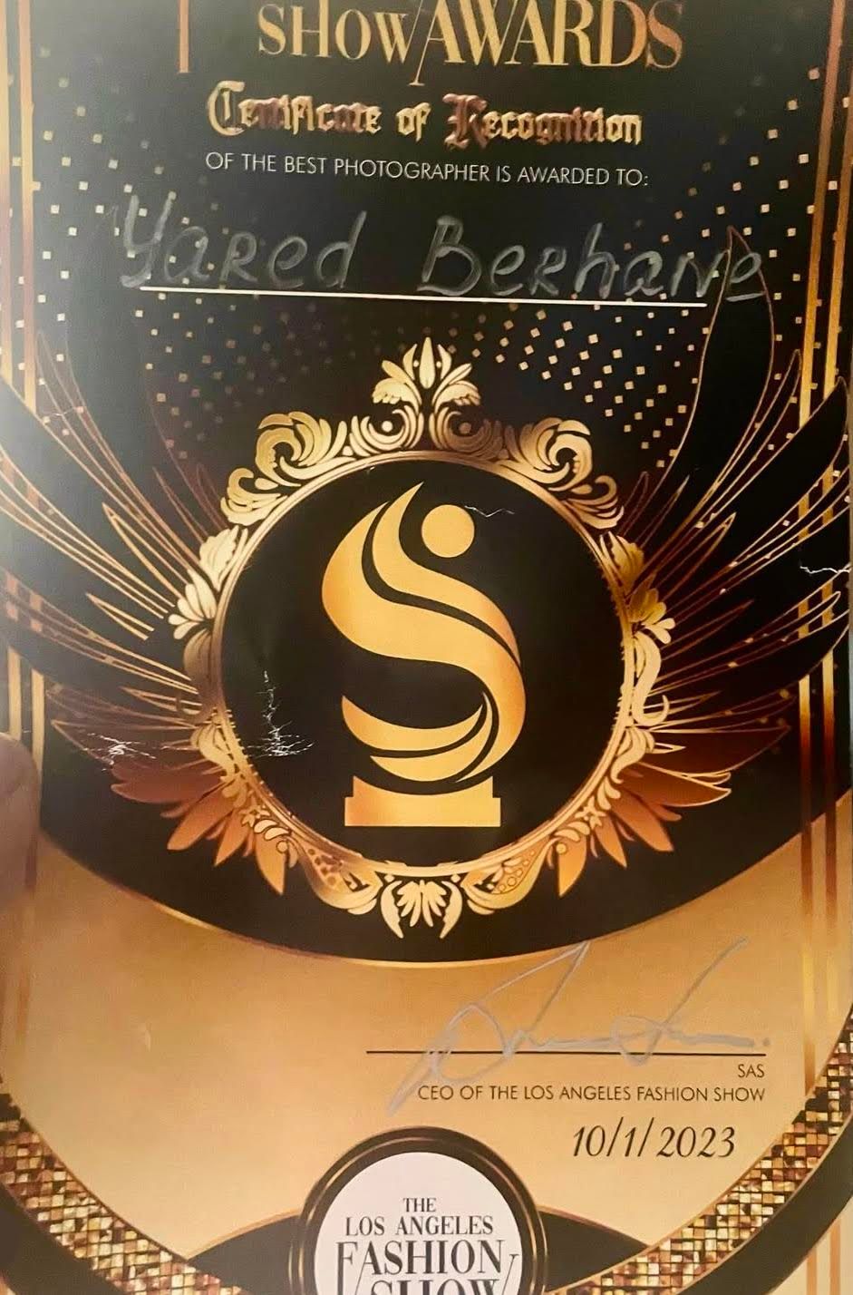 Award certificate with gold embossed logo for best photographer at Los Angeles Fashion Show Awards.