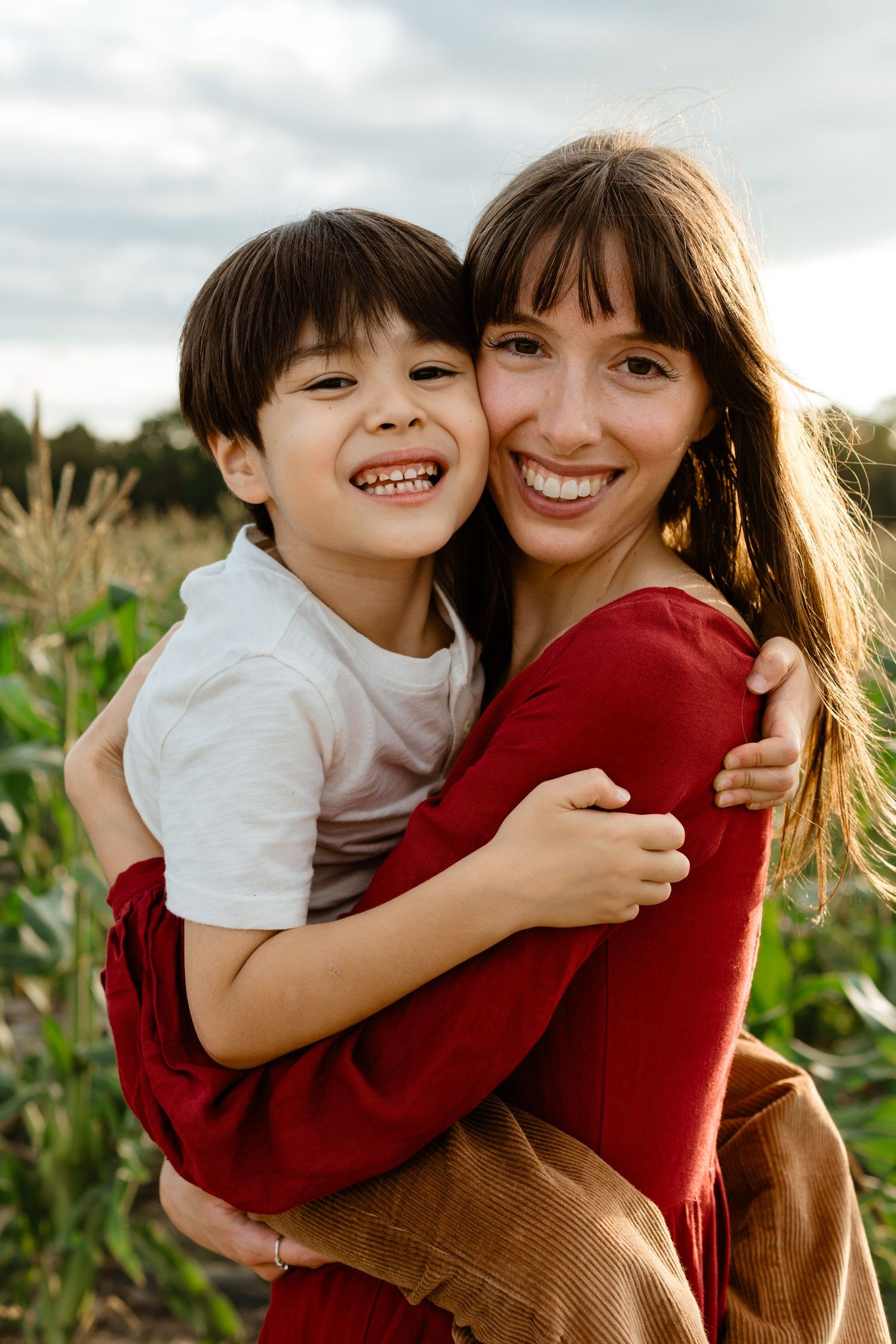Fall mini session, corn field, mom and son smiling by Cherry Hill family photographer