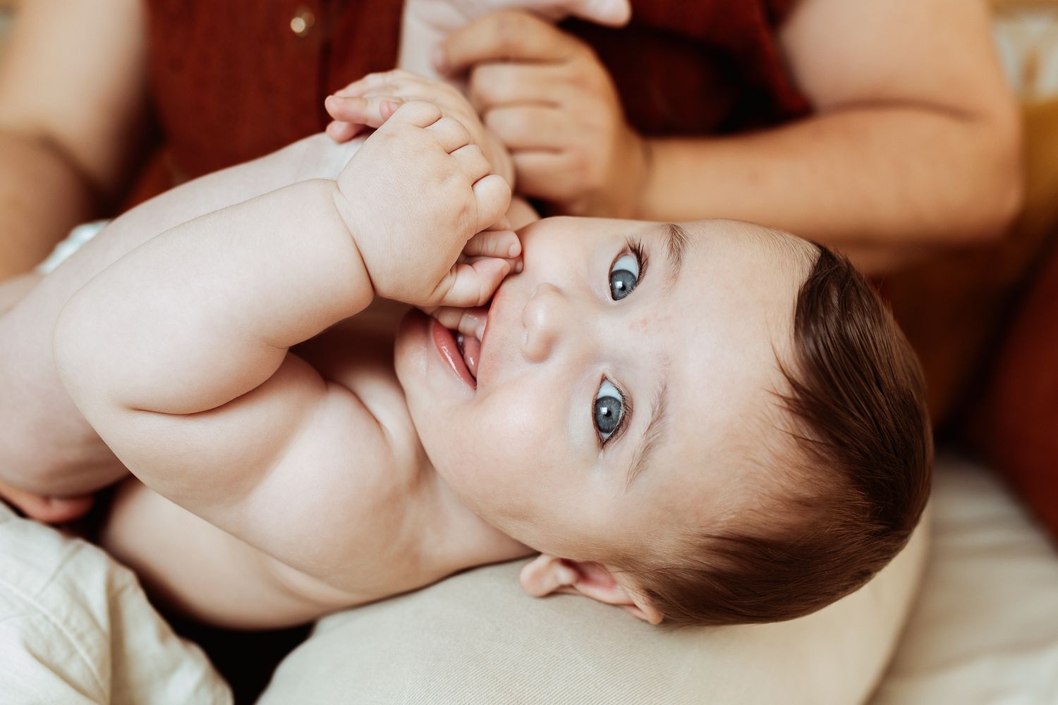 Tender moment with infant during gentle massage.