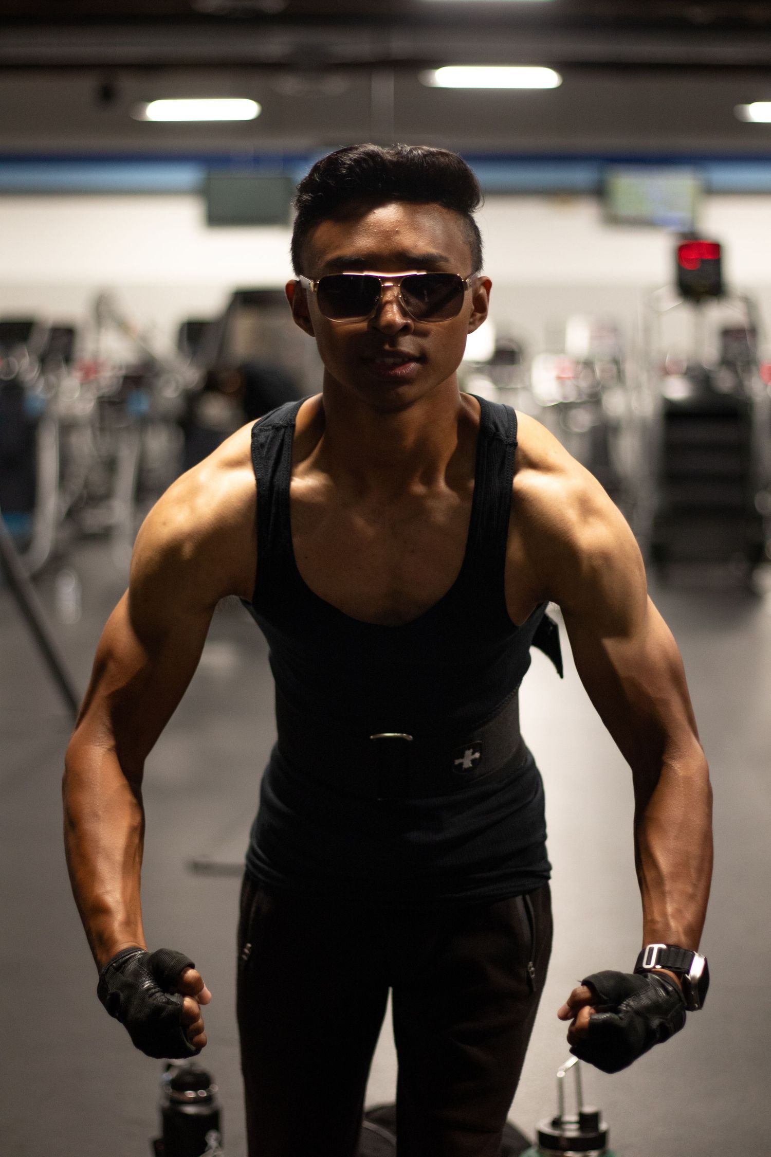 Fitness photography session in Long Beach gym showing athlete posing by Justicee Photography
