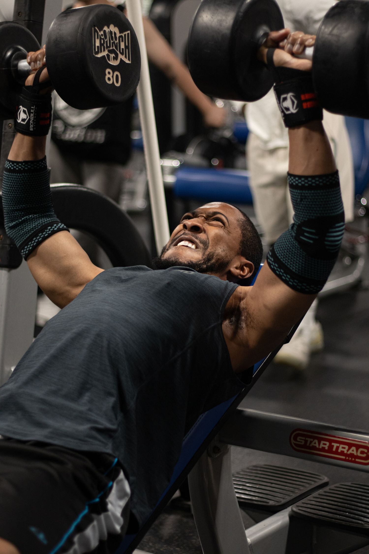 Fitness photography session in Long Beach gym showing athlete performing incline press by Justicee Photography