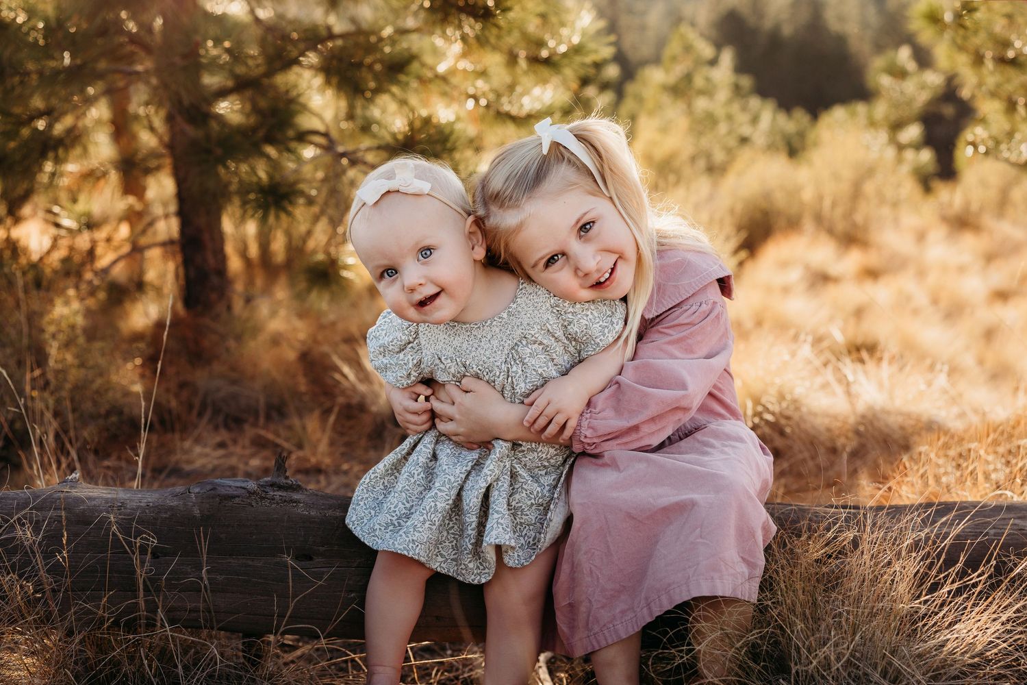 Black and white family portrait showing joyful expressions in outdoor setting.