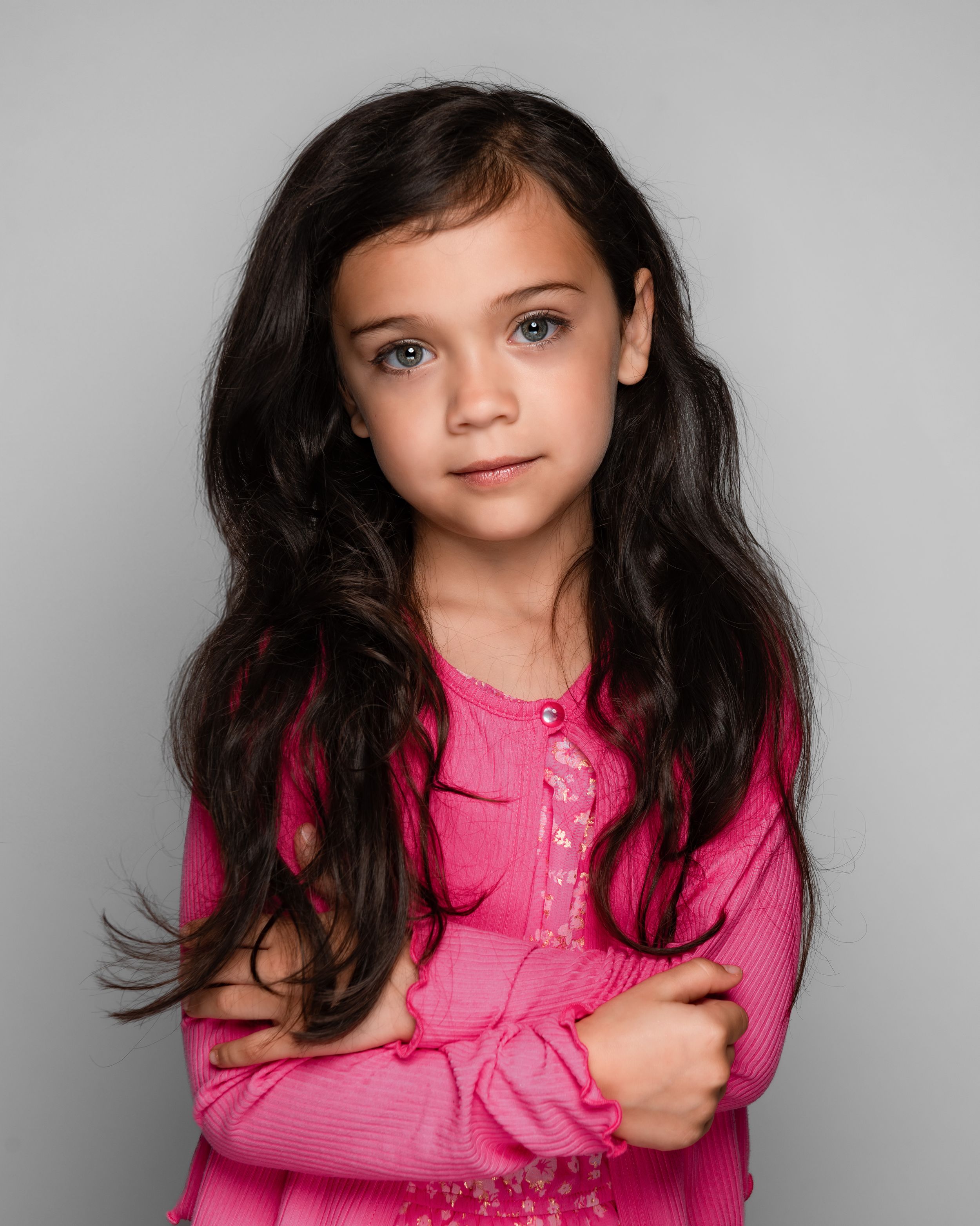 Portrait of a child in a pink shirt
