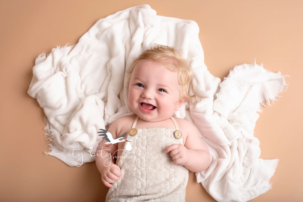 Lagrange Milestone Baby Photos in cute six month outfit parents
