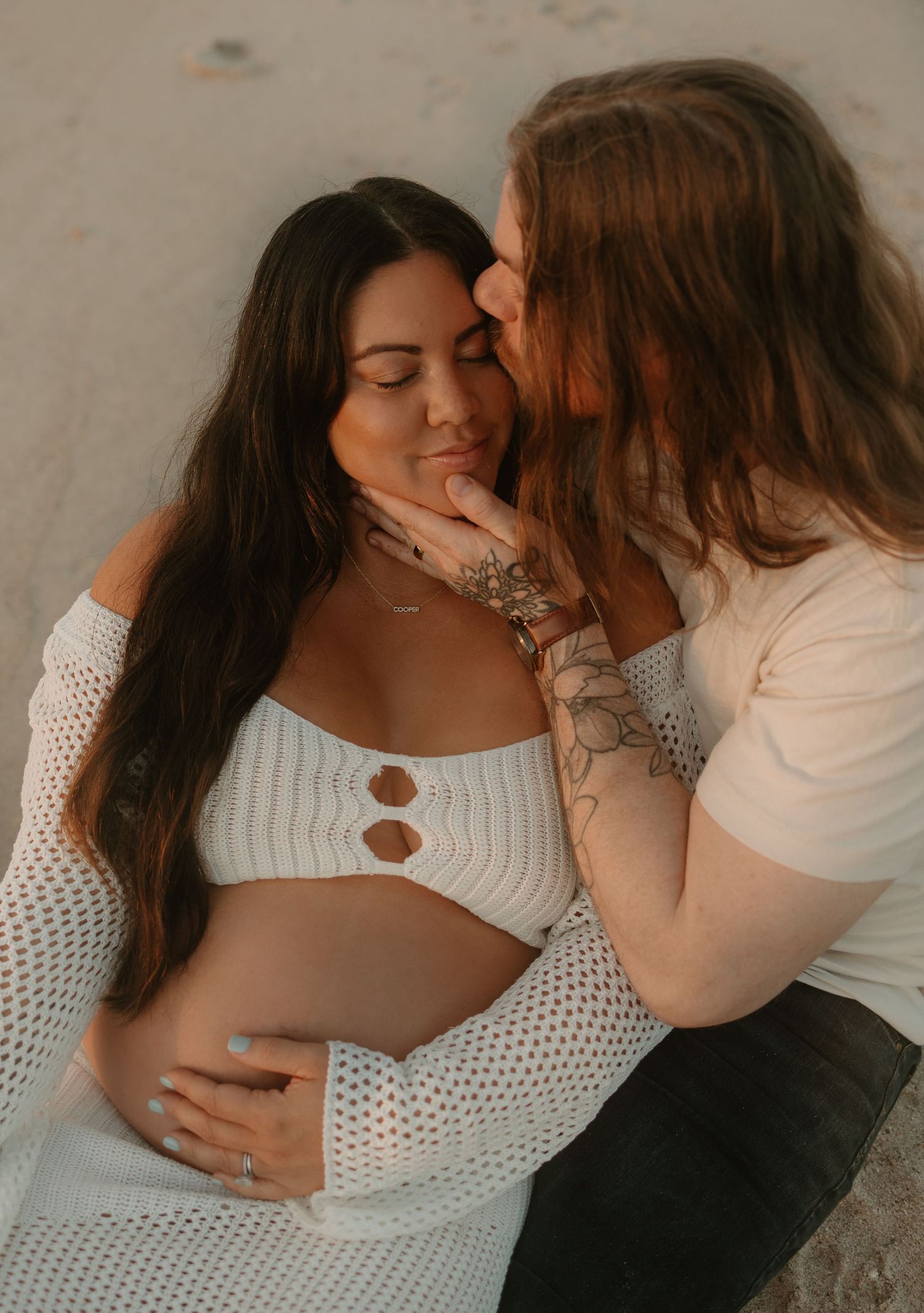Intimate couple in white tops sharing tender moments together.