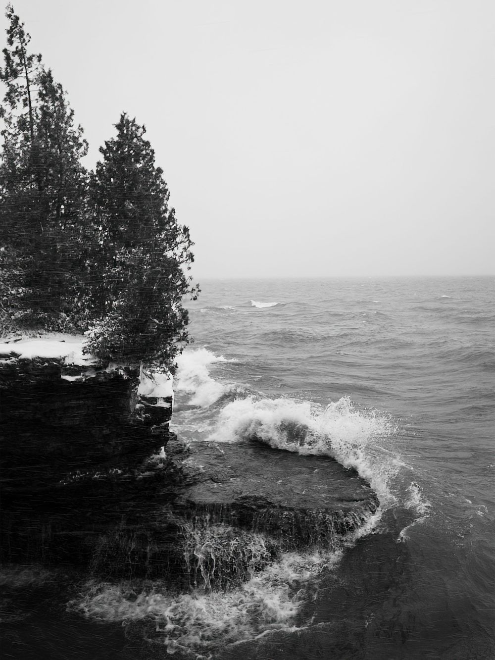 Black and white photograph of winter waves on Lake Michigan