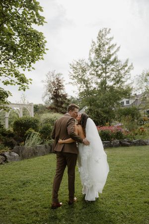 A romantic wedding sequence of a couple in a garden setting with the bride in white and groom in brown attire.