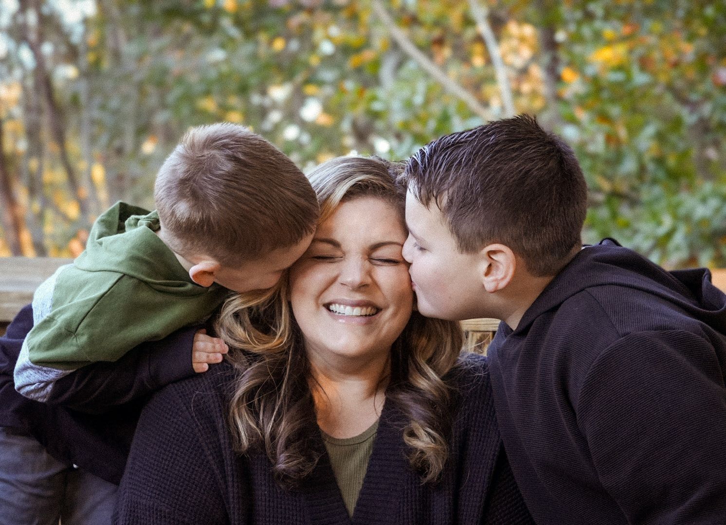 A series of candid outdoor family moments captured in warm autumn lighting.
