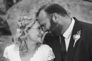Intimate black and white wedding portraits showing tender moments between newlyweds.