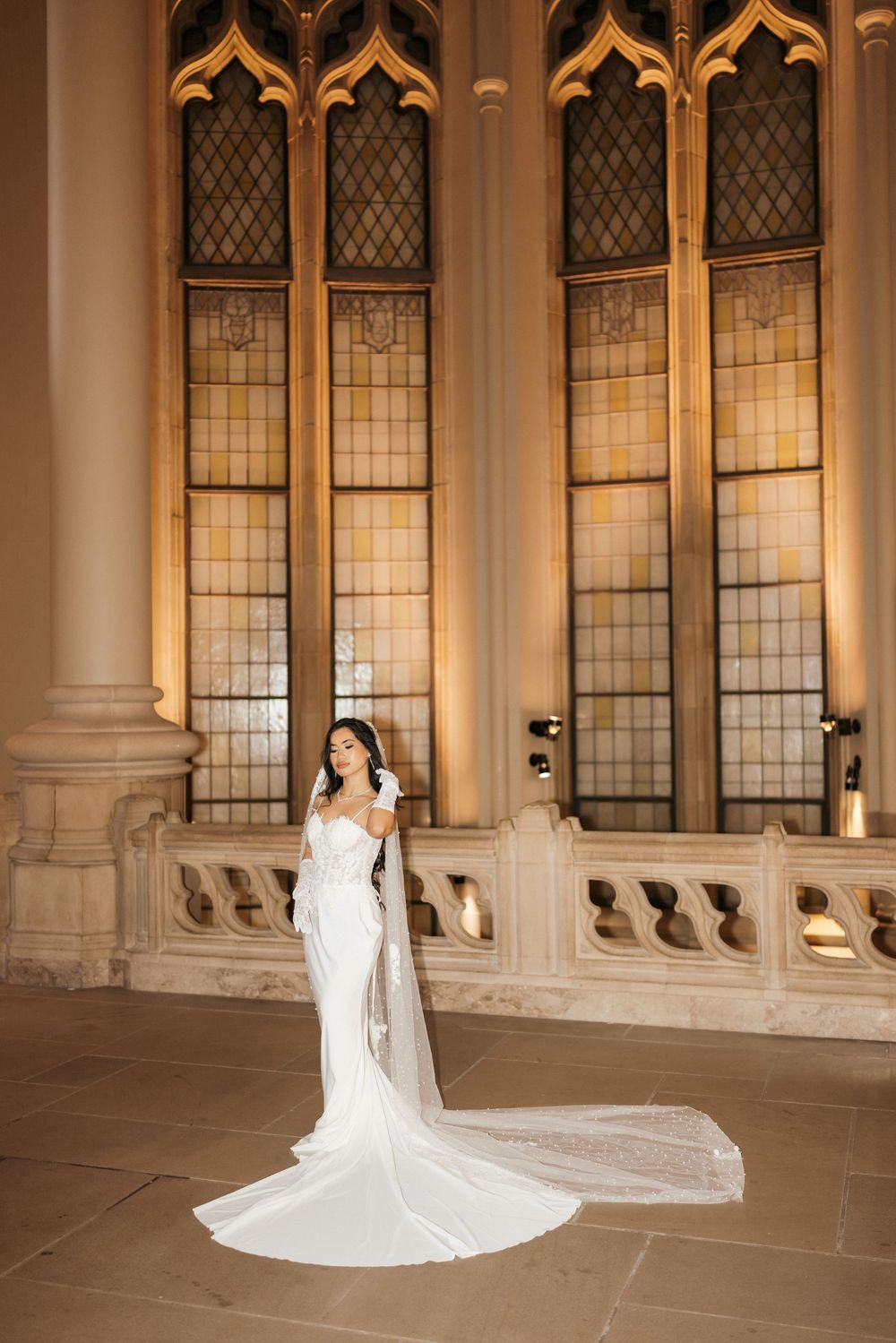 A series of bridal portraits showcasing a flowing white wedding gown against ornate cathedral windows and architecture.