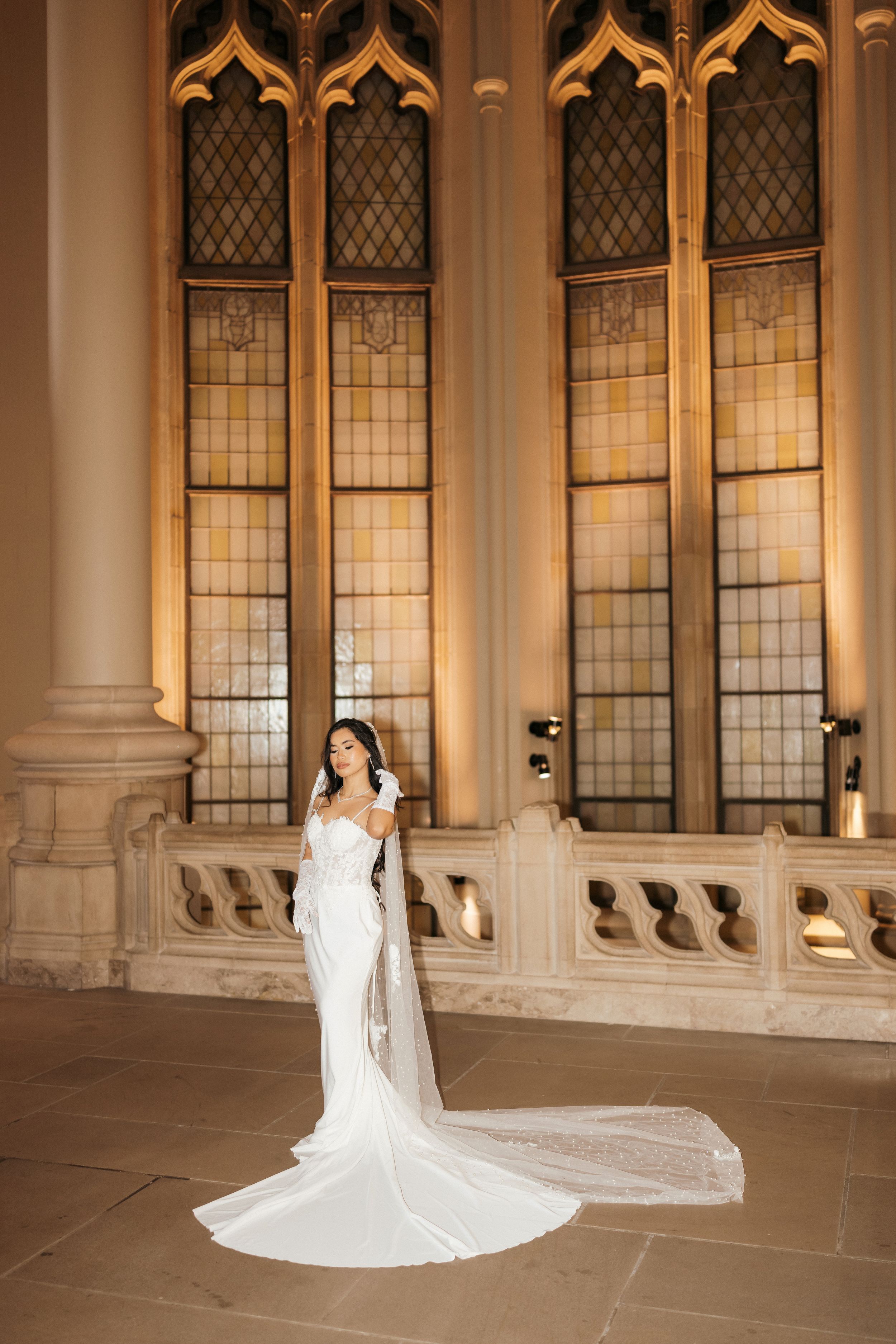 A series of bridal portraits showcasing a flowing white wedding gown against ornate cathedral windows and architecture.