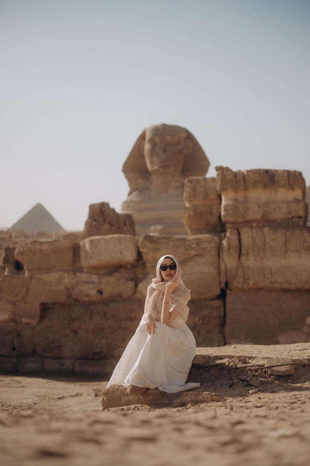 A series of desert landscape photos showing ancient Egyptian pyramids and sphinx monuments in the sandy background.