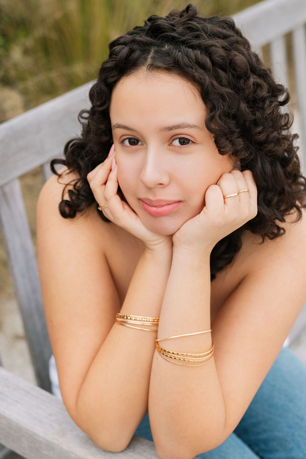 High school senior Maria smiling during her portrait session at Corsair Beach on Jekyll Island