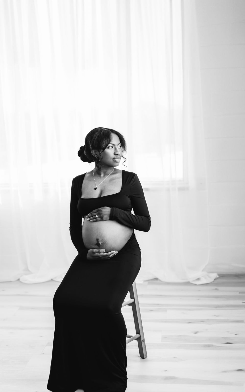 Artistic black and white maternity photoshoot with flowing fabric and natural light Waterbury, CT.