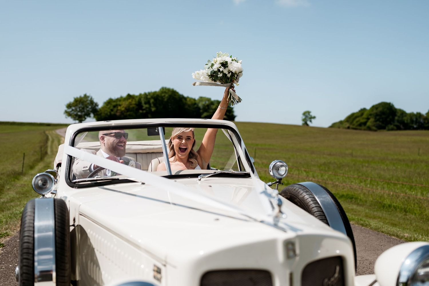 St Tewdrics newlyweds bumping hips having fun