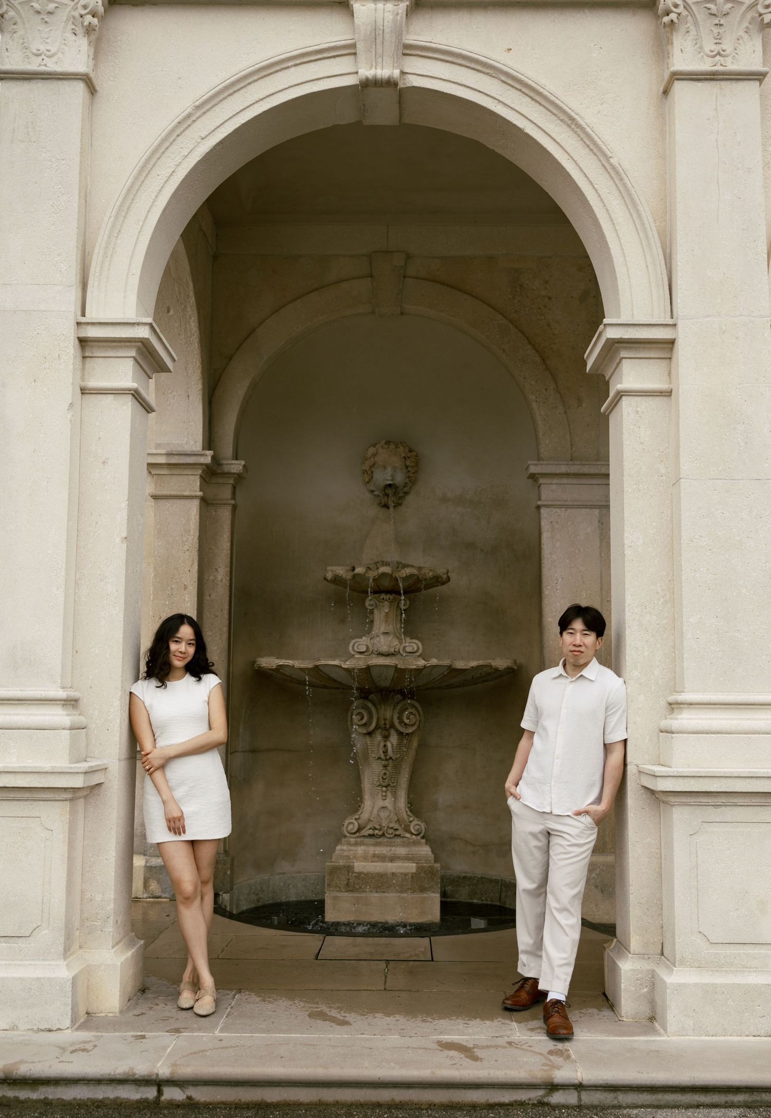 Artistic sequence of poses in front of an elegant white archway.