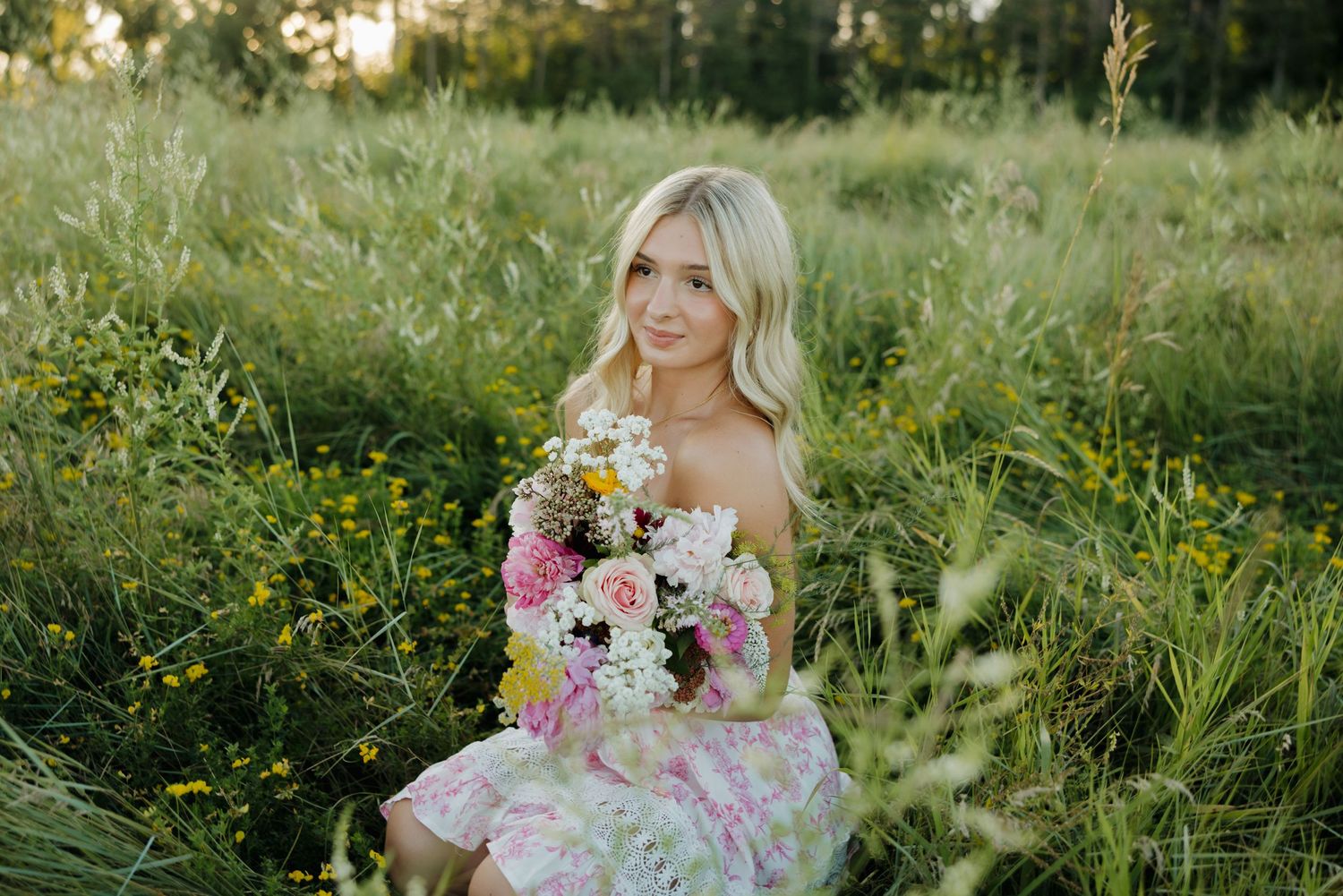 Ivy covered rustic barn wall creates dramatic backdrop for outdoor portrait.
