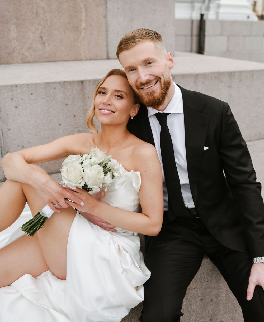A series of candid wedding photos showing a couple in formal attire sitting on concrete steps.